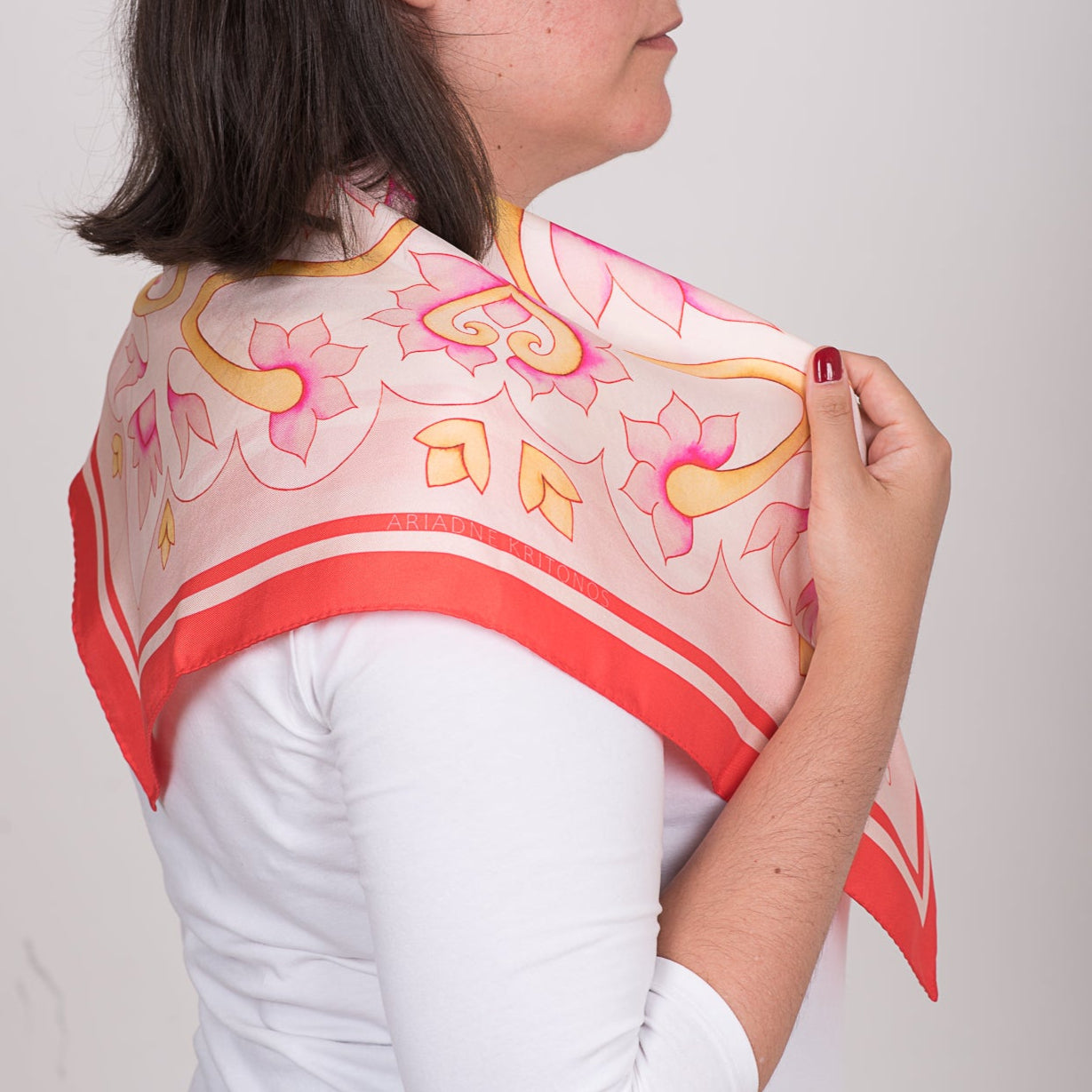 Floral pink Attica Garden silk scarf by Ariadne Kritonos worn on the back