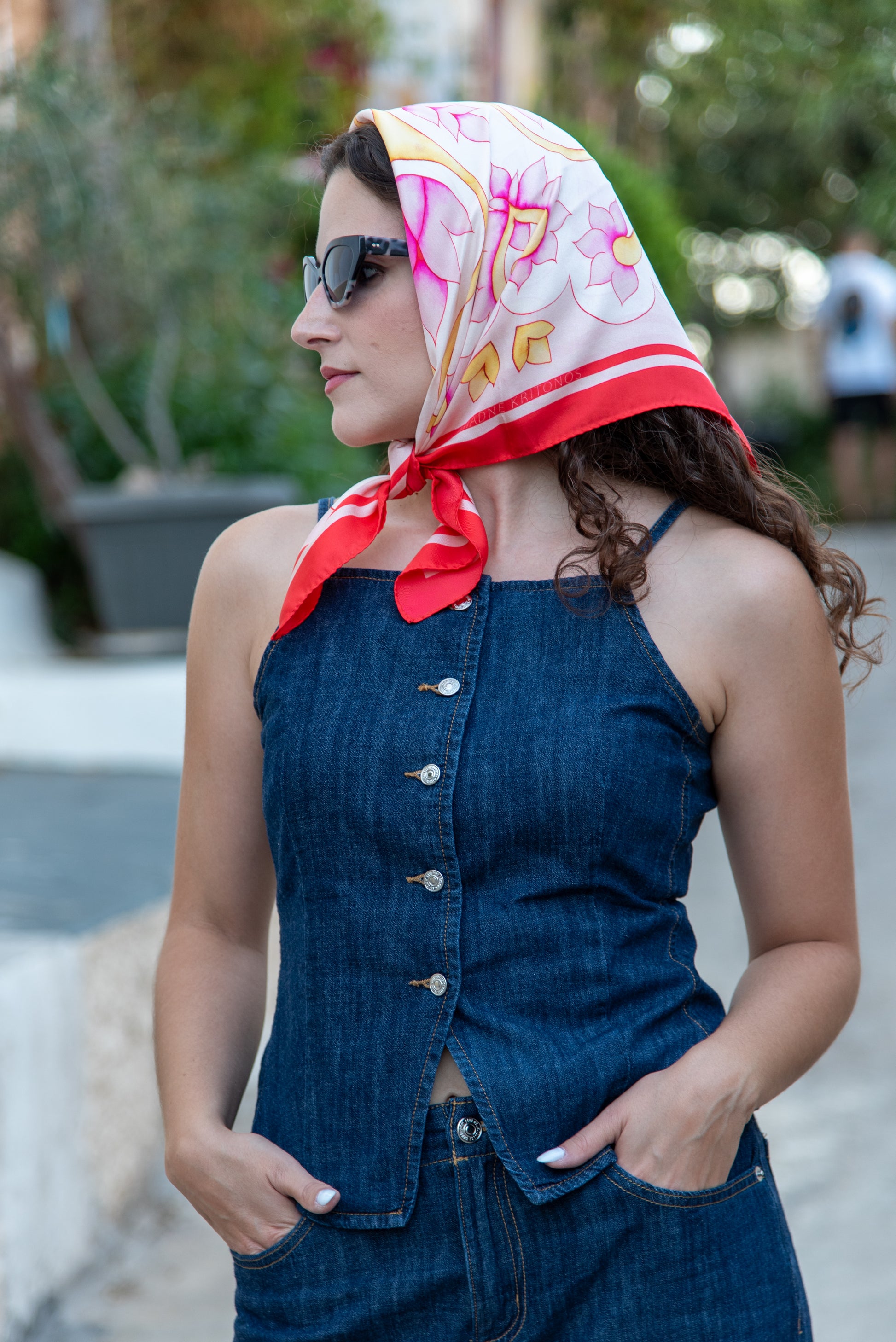 model wearing pink Attica Garden silk scarf tied as headscarf, Greek folk art design by Ariadne Kritonos