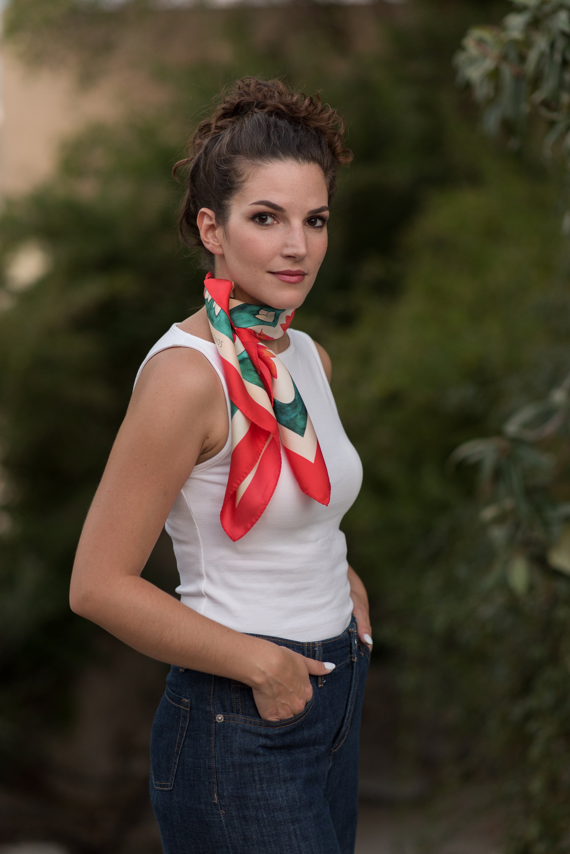 Model styling Teal Attica Garden silk scarf by Ariadne Kritonos tied as neck accessory
