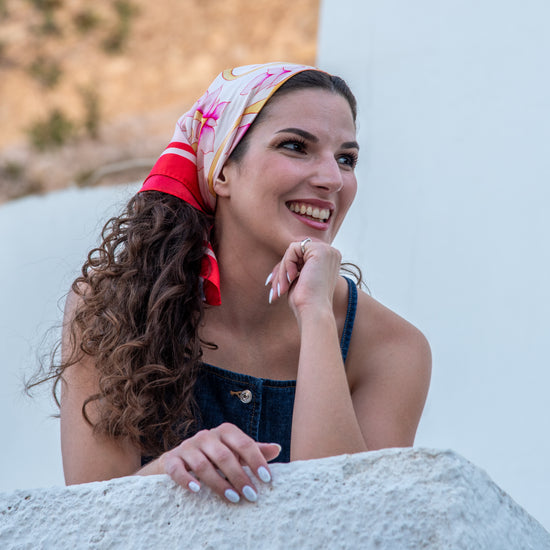 Video of model wearing pink Attica Garden silk scarf, ending with blue Attica Garden scarf shown on second model