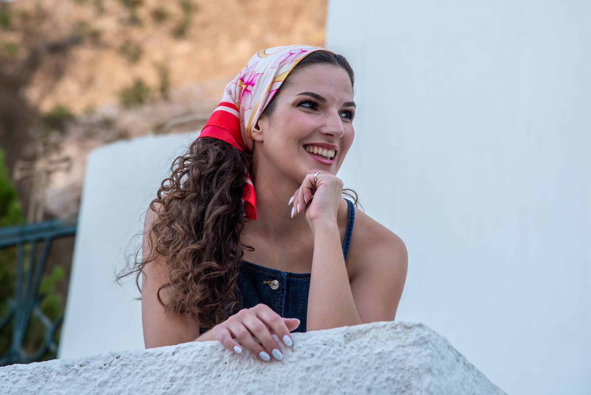 Video of model wearing pink Attica Garden silk scarf, ending with blue Attica Garden scarf shown on second model